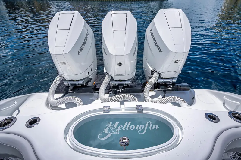 Slide: The Image of 2025 Yellowfin 36 Offshore boat with triple Mercury engines on water. - 25