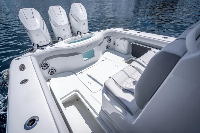 Slide: The Image of 2025 Yellowfin 36 Offshore boat interior with triple Mercury engines on water. - 27