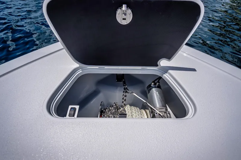 Slide: The Image of Open anchor compartment on 2025 Yellowfin 36 Offshore boat, showing chain and rope. - 28