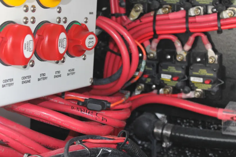 Slide: The Image of Electrical panel with red cables in a 2025 Yellowfin 36 Offshore boat. - 39