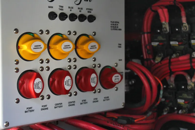 Slide: The Image of 2025 Yellowfin 36 Offshore boat control panel with switches and wiring. - 40