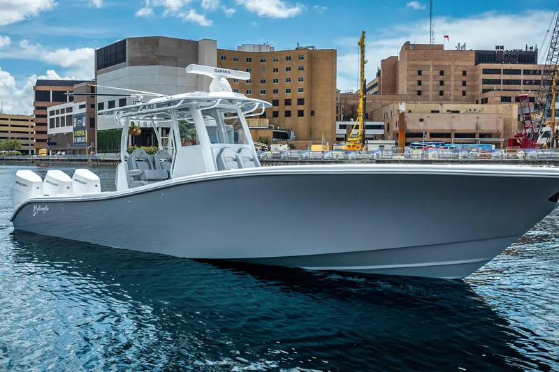 Slide: The Image of 2025 Yellowfin 36 Offshore boat docked in urban marina setting. - 42