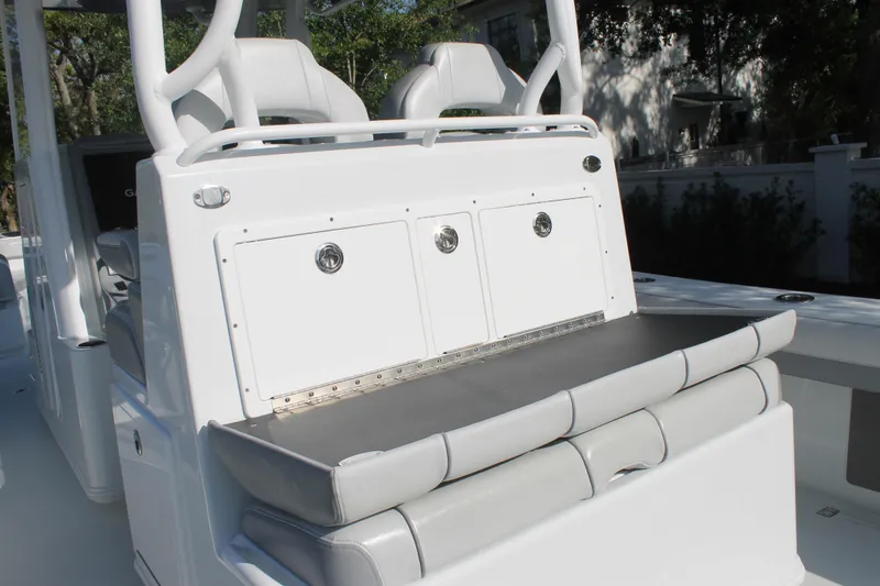 Slide: The Image of 2025 Yellowfin 36 Offshore boat interior with cushioned seating and storage compartments. - 6