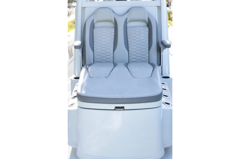 Slide: The Image of 2025 Yellowfin 36 Offshore boat seat with gray upholstery and armrests. - 8