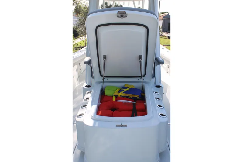 Slide: The Image of Open storage compartment on 2025 Yellowfin 36 Offshore boat with life jackets inside. - 9