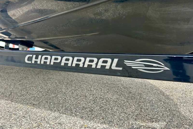 Slide: The Image of Chaparral 203 Vortex 2017 boat trailer with logo on pavement background. - 12