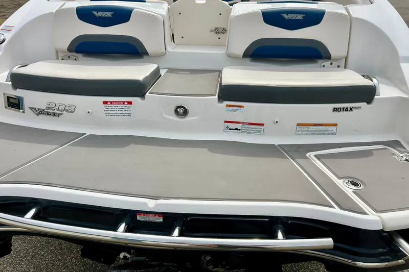Slide: The Image of 2017 Chaparral 203 Vortex boat rear view with seating and Rotax engine branding. - 19