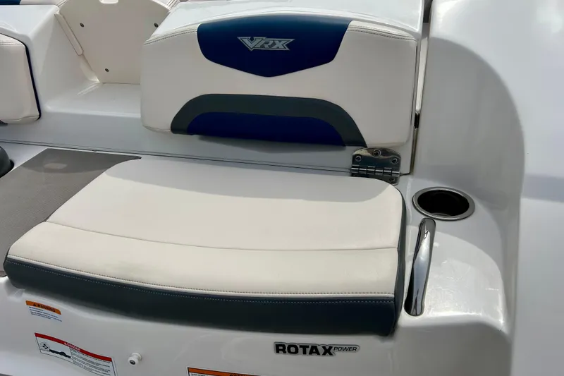 Slide: The Image of 2017 Chaparral 203 Vortex boat seating with Rotax power branding and cup holder. - 21