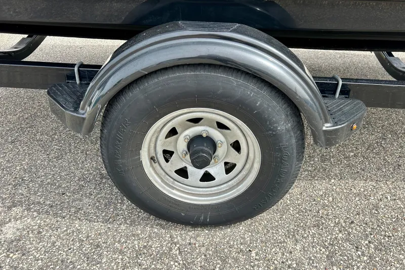 Slide: The Image of Trailer wheel of 2017 Chaparral 203 Vortex on asphalt surface. - 26