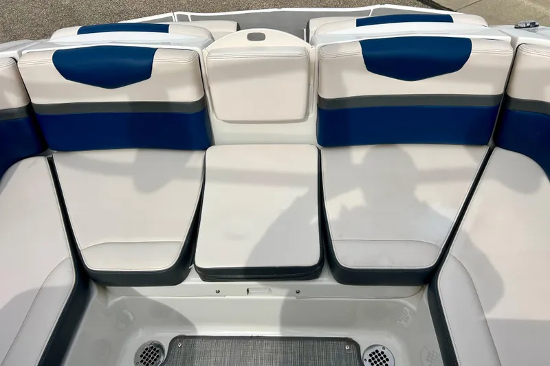 Slide: The Image of 2017 Chaparral 203 Vortex boat interior with blue and white seating arrangement. - 31
