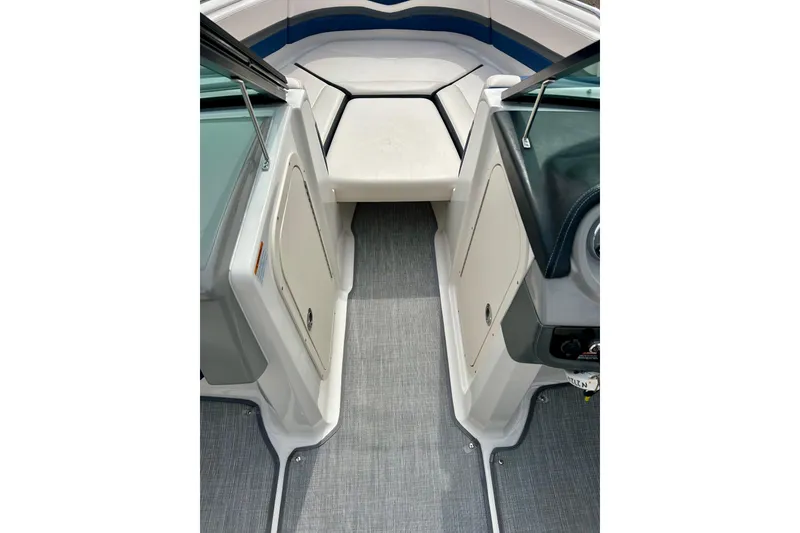 Slide: The Image of 2017 Chaparral 203 Vortex boat interior with gray flooring and white seating. - 35
