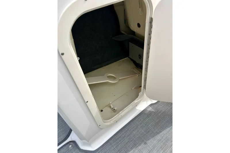 Slide: The Image of Storage compartment inside a 2017 Chaparral 203 Vortex boat, featuring a clean interior. - 36