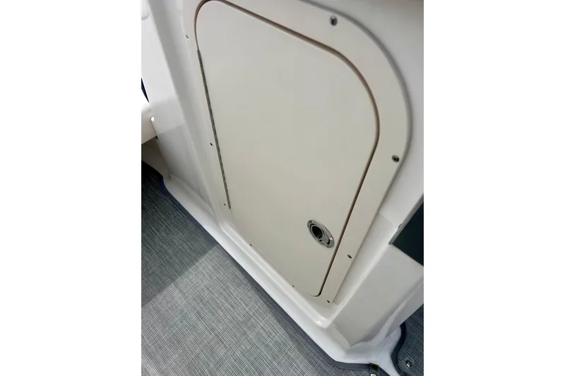 Slide: The Image of 2017 Chaparral 203 Vortex boat storage compartment with sleek design and secure latch. - 37