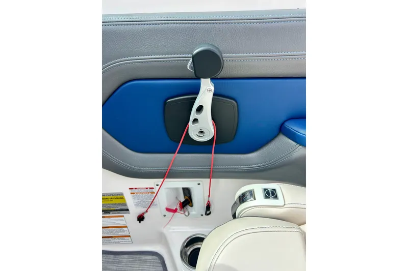 Slide: The Image of Interior detail of a 2017 Chaparral 203 Vortex boat, featuring blue and gray upholstery. - 41