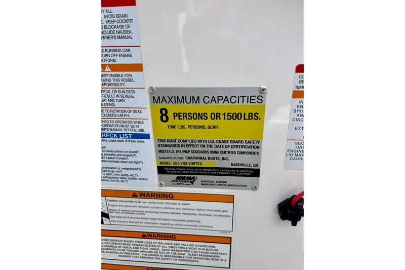 Slide: The Image of 2017 Chaparral 203 Vortex capacity label: 8 persons or 1500 lbs, safety compliance details. - 42