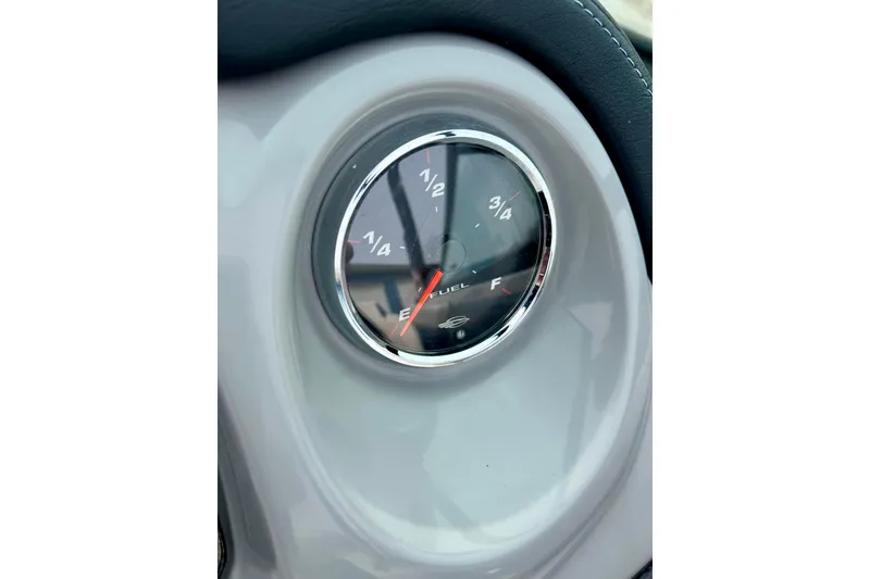 Slide: The Image of Fuel gauge of a 2017 Chaparral 203 Vortex boat, showing near empty. - 44