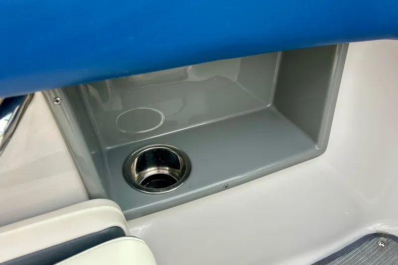 Slide: The Image of Cup holder and storage compartment in 2017 Chaparral 203 Vortex boat interior. - 48