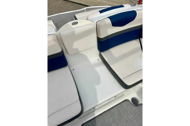 Slide: The Image of 2017 Chaparral 203 Vortex boat interior seating with blue and white upholstery. - 54