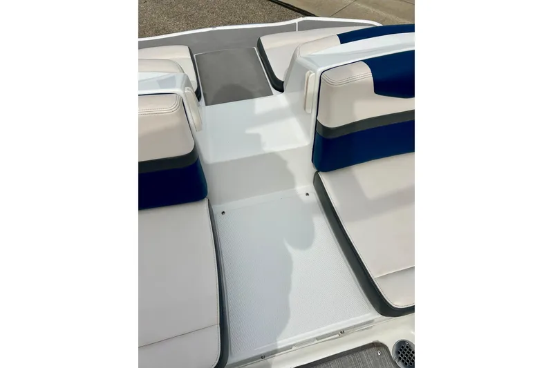 Slide: The Image of 2017 Chaparral 203 Vortex boat interior with white and blue seating. - 55