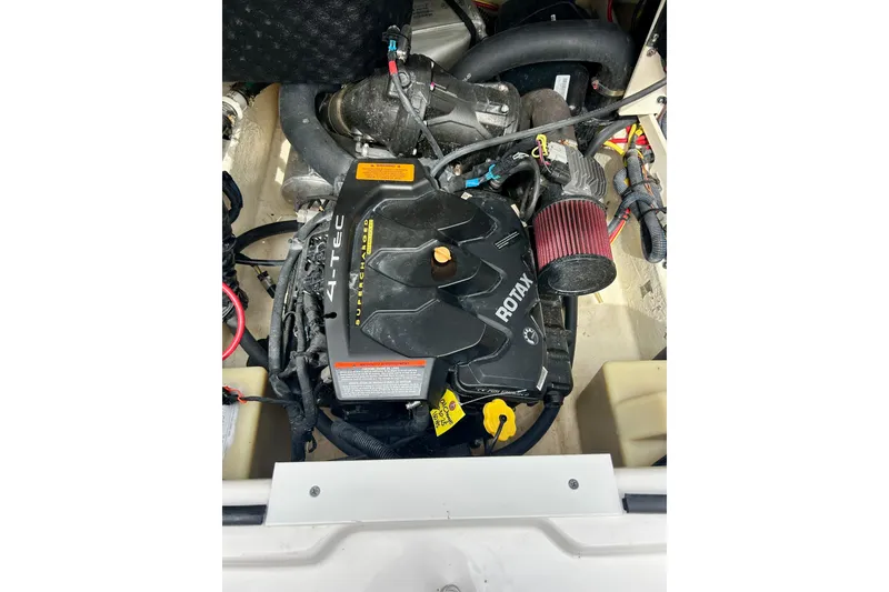 Slide: The Image of Engine compartment of a 2017 Chaparral 203 Vortex boat featuring a Rotax motor. - 56