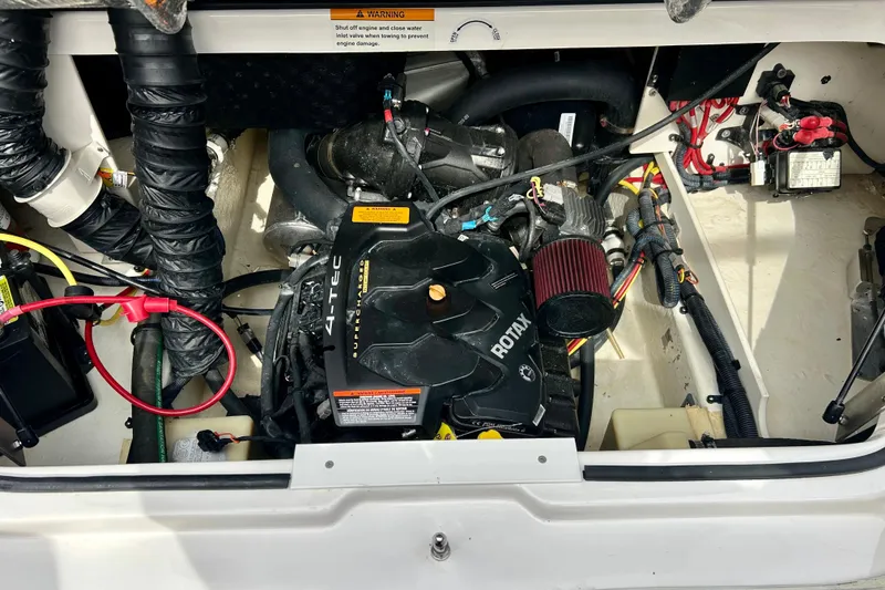 Slide: The Image of Engine compartment of a 2017 Chaparral 203 Vortex boat, featuring a Rotax engine. - 57