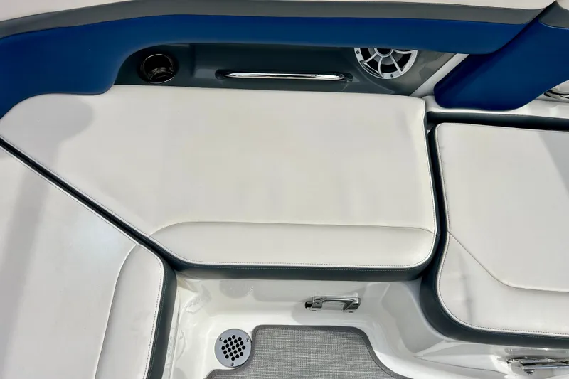 Slide: The Image of Interior seating of 2017 Chaparral 203 Vortex boat with white cushions and blue accents. - 59