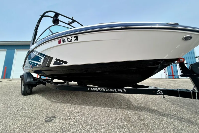 Slide: The Image of 2017 Chaparral 203 Vortex boat on trailer, parked outdoors. - 79