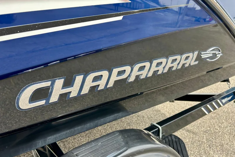 Slide: The Image of 2017 Chaparral 203 Vortex boat logo on sleek black exterior. - 82