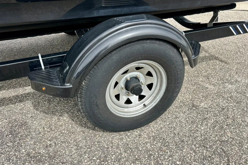 Slide: The Image of Trailer wheel of 2017 Chaparral 203 Vortex on asphalt surface. - 83