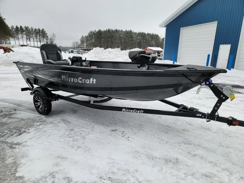 The Image of 2024 MirroCraft 1686 boat on trailer in snowy setting. - 1