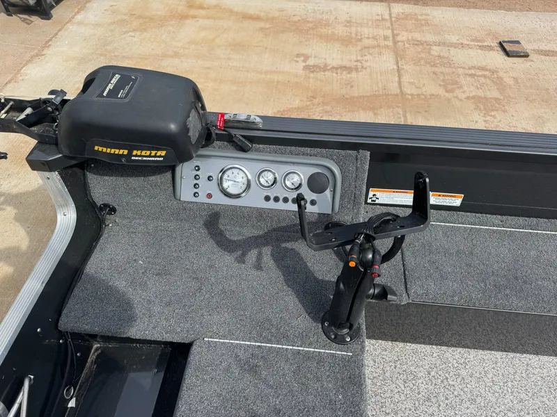 Slide: The Image of 2024 MirroCraft 1686 boat with Minn Kota motor and control console. - 10