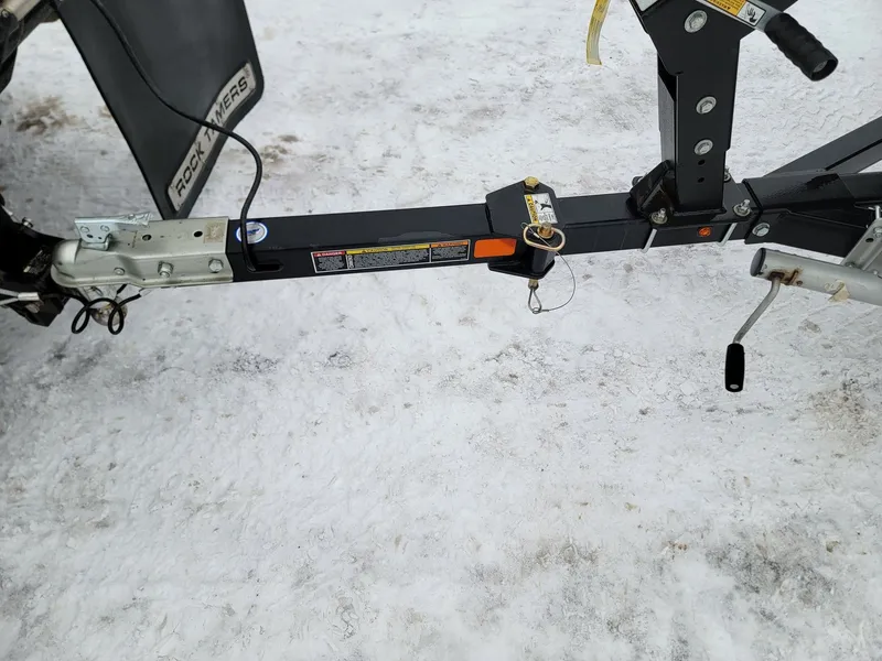 Slide: The Image of MirroCraft 1686 trailer hitch on snowy ground, year 2024. - 15