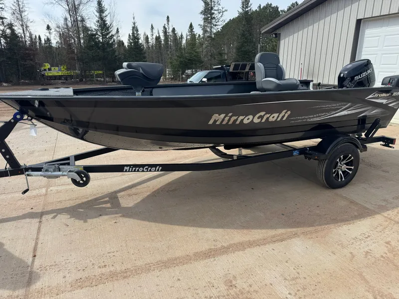 Slide: The Image of 2024 MirroCraft 1686 boat on trailer, Suzuki motor, forest background. - 2