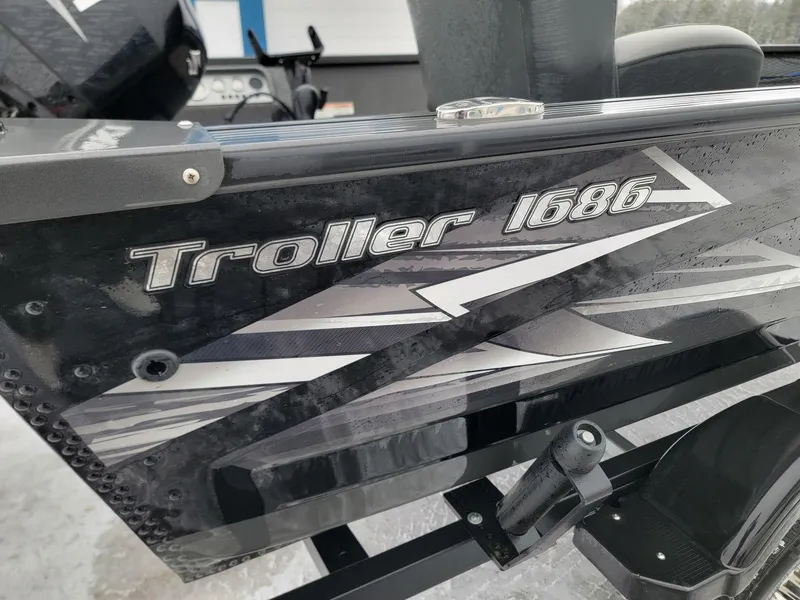 Slide: The Image of 2024 MirroCraft Troller 1686 boat hull close-up. - 3