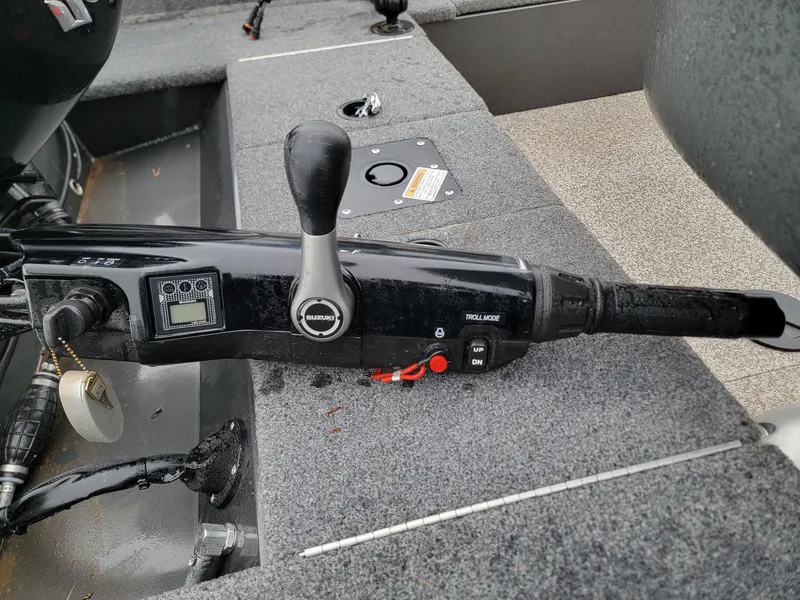 Slide: The Image of Close-up of the throttle lever on a 2024 MirroCraft 1686 boat. - 6