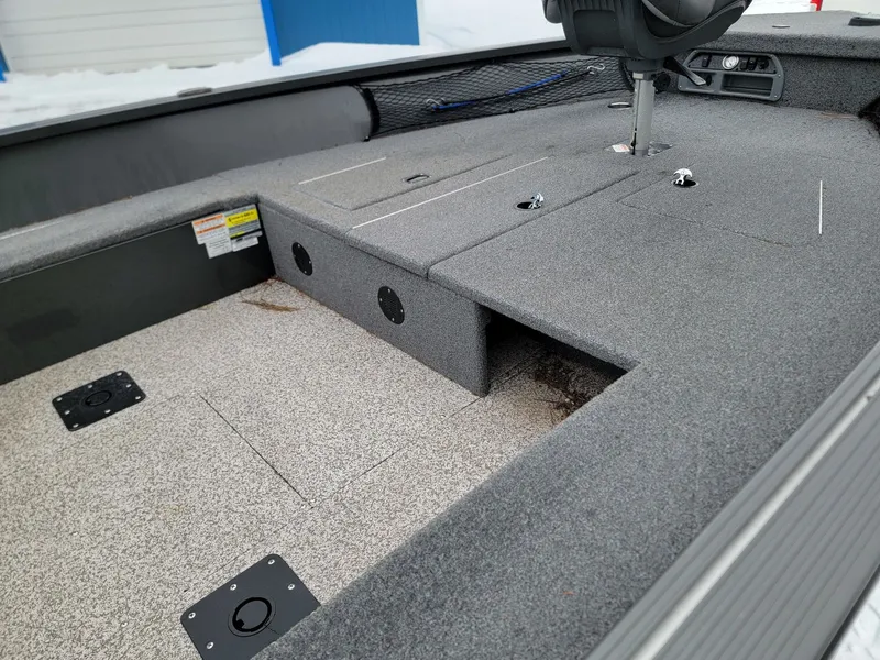 Slide: The Image of Interior of 2024 MirroCraft 1686 boat with gray carpeting. - 8