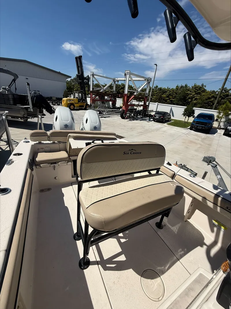 Slide: The Image of 2023 Sea Chaser 24 HFC boat with outdoor seating. - 11