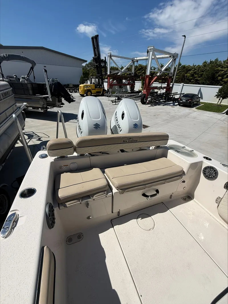 Slide: The Image of 2023 Sea Chaser 24 HFC boat with dual outboard engines. - 12