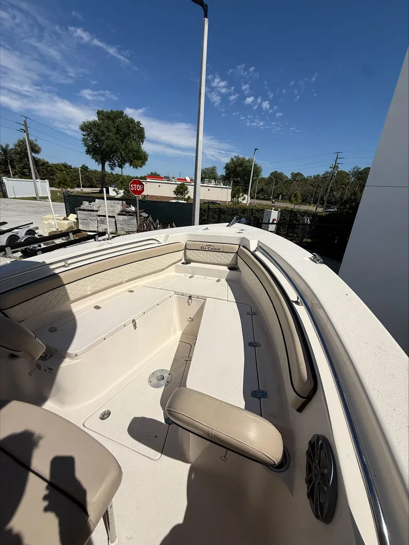 Slide: The Image of 2023 Sea Chaser 24 HFC boat, interior view under sunny skies. - 5