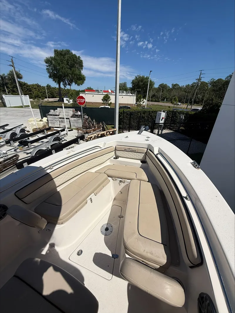 Slide: The Image of Interior view of 2023 Sea Chaser 24 HFC boat with beige seating. - 6