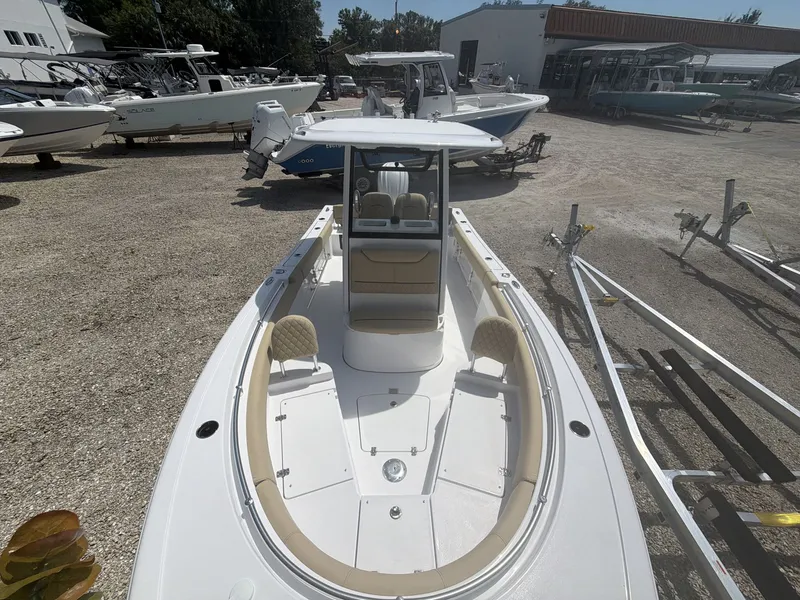 Slide: The Image of 2026 Sportsman Heritage 231 Center Console boat in a parking lot. - 16