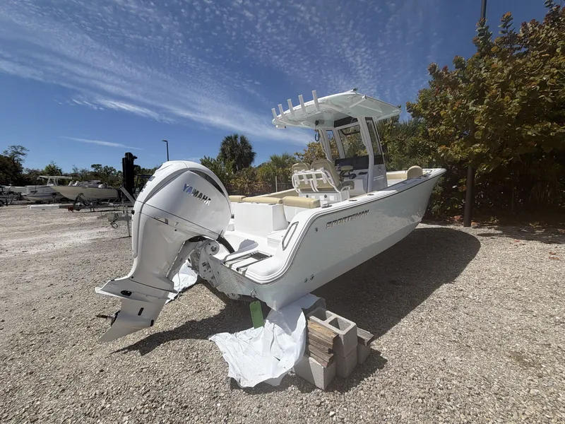 Slide: The Image of 2026 Sportsman Heritage 231 Center Console boat parked outdoors. - 5