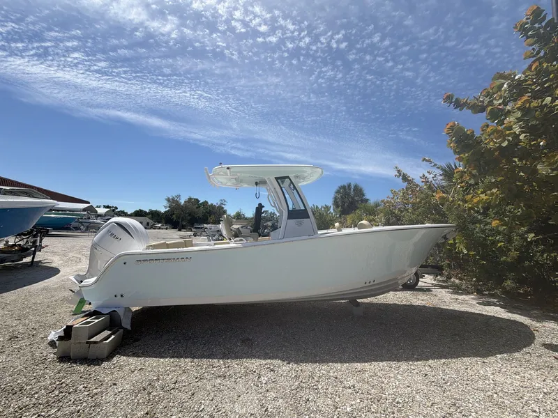 Slide: The Image of 2026 Sportsman Heritage 231 Center Console on gravel lot under sunny skies. - 9