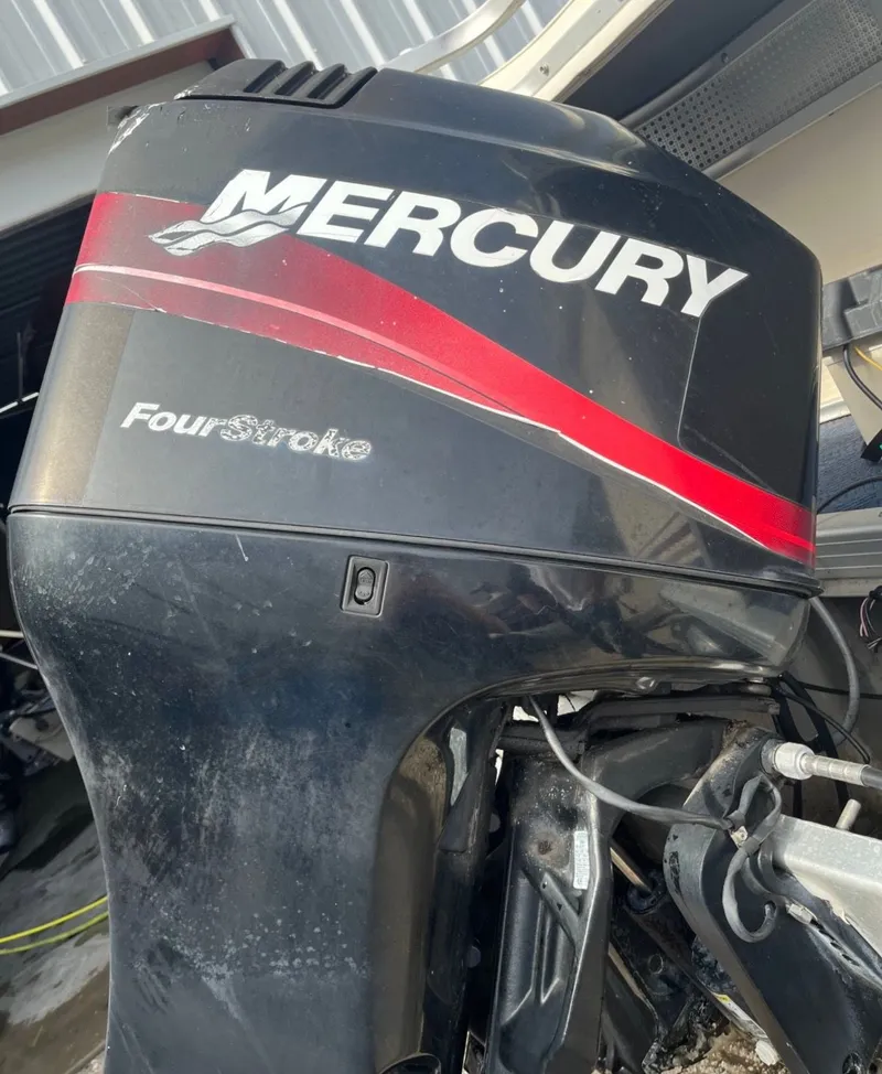 Slide: The Image of Mercury FourStroke outboard motor on a 2001 Sylvan 8526 Capri boat. - 17