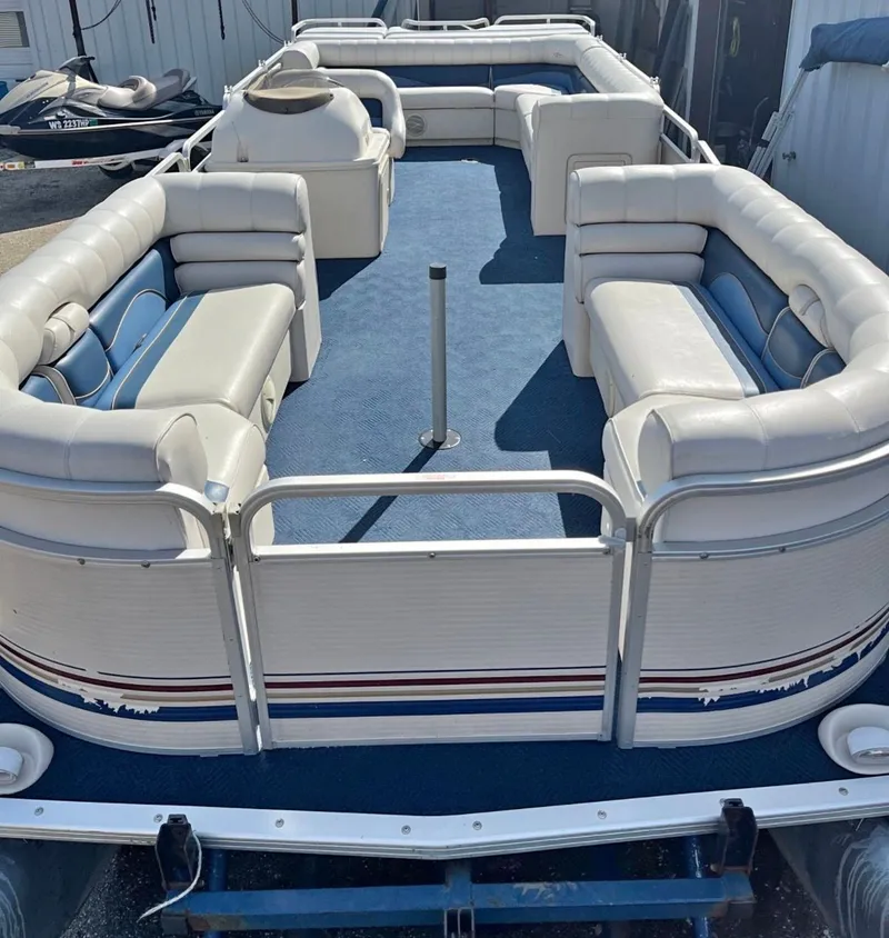 Slide: The Image of 2001 Sylvan 8526 Capri pontoon boat with blue carpet and white seating. - 7
