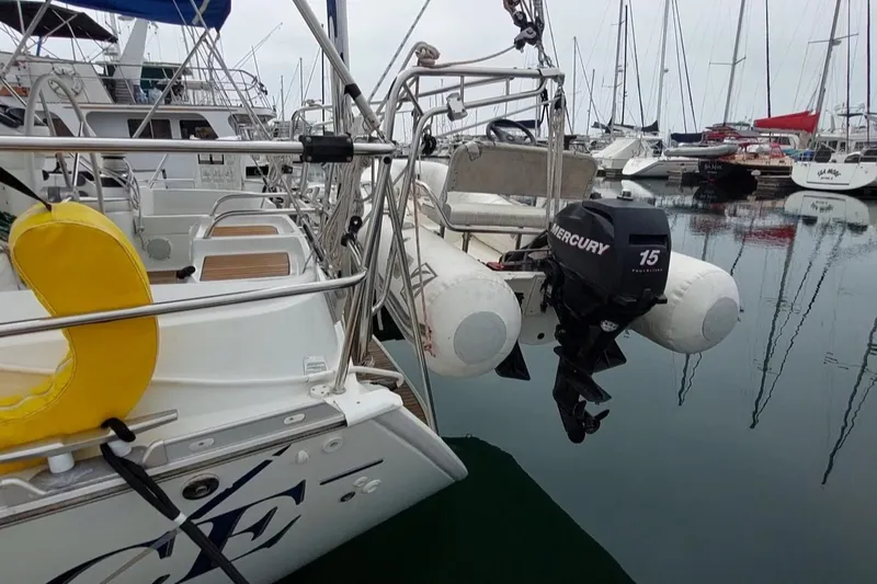 Slide: The Image of Jeanneau Sun Odyssey 43 DS yacht with Mercury outboard motor in marina, 2002 model. - 10