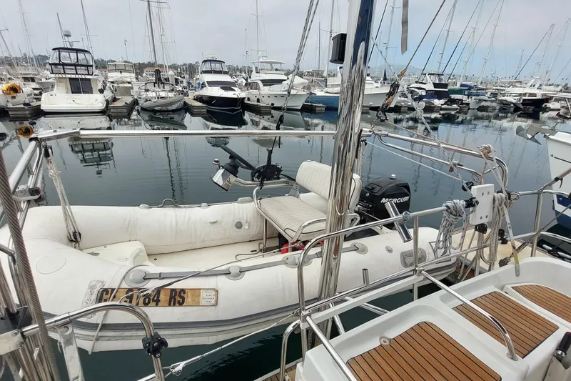 Slide: The Image of Jeanneau Sun Odyssey 43 DS sailboat with dinghy in marina, 2002 model. - 11