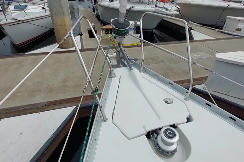 Slide: The Image of Bow of 2002 Jeanneau Sun Odyssey 43 DS yacht docked at marina. - 12