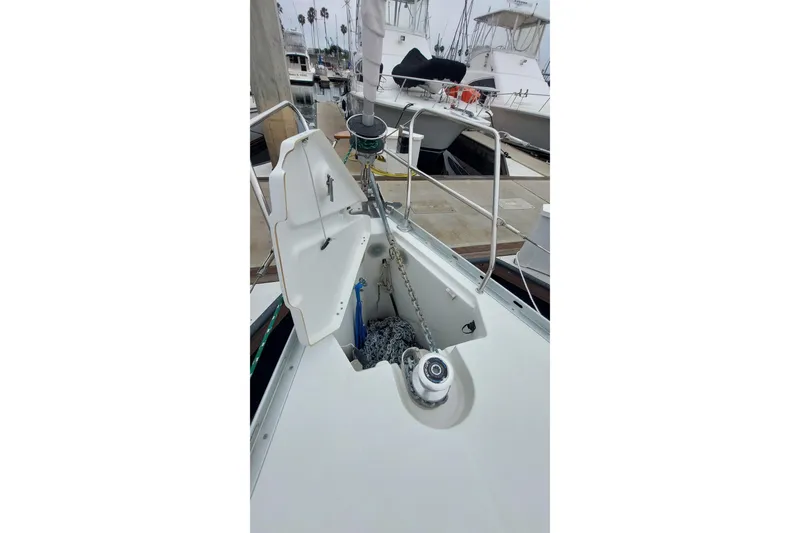 Slide: The Image of Jeanneau Sun Odyssey 43 DS 2002 sailboat anchor locker with chain and winch. - 13