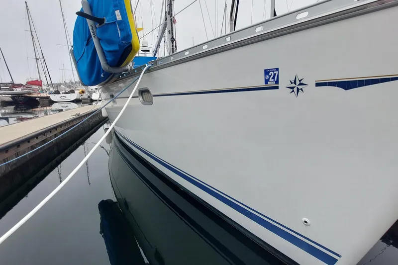 Slide: The Image of Jeanneau Sun Odyssey 43 DS yacht docked, showcasing sleek design and nautical details. - 14